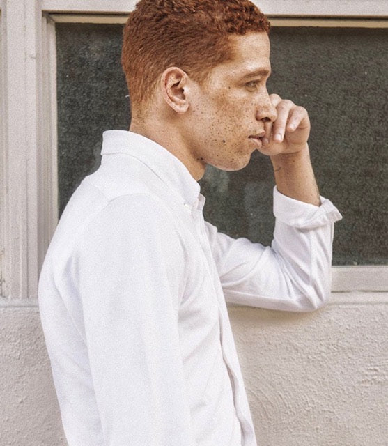Man with freckled skin and red hair — illustrating natural skin and the importance of daily sun protection